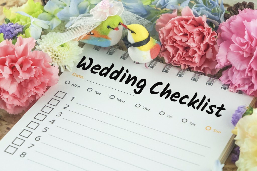 word wedding checklist note paper on pink flower wedding bird background